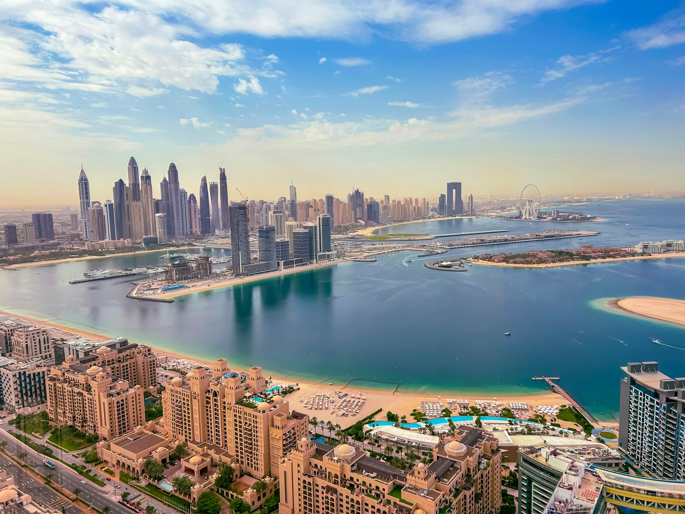 Dubai Harbour, the Marina towers and Ain Dubai across the water from the Palm Jumeirah