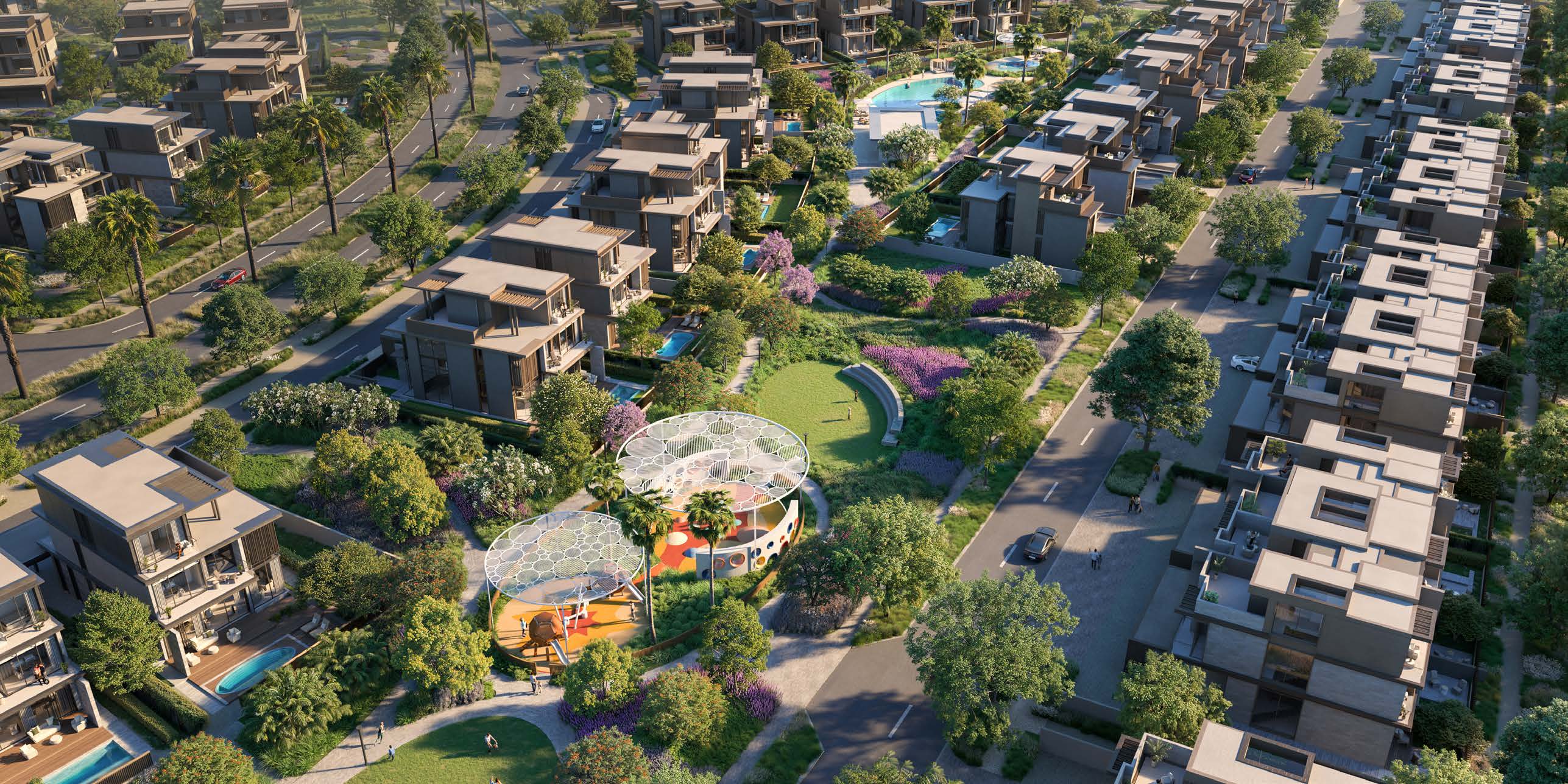 Nad Al Sheba Gardens from the air: villa streets, parks and a pool