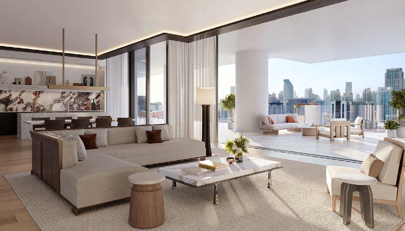 Bright living room opening onto a wide terrace above the city
