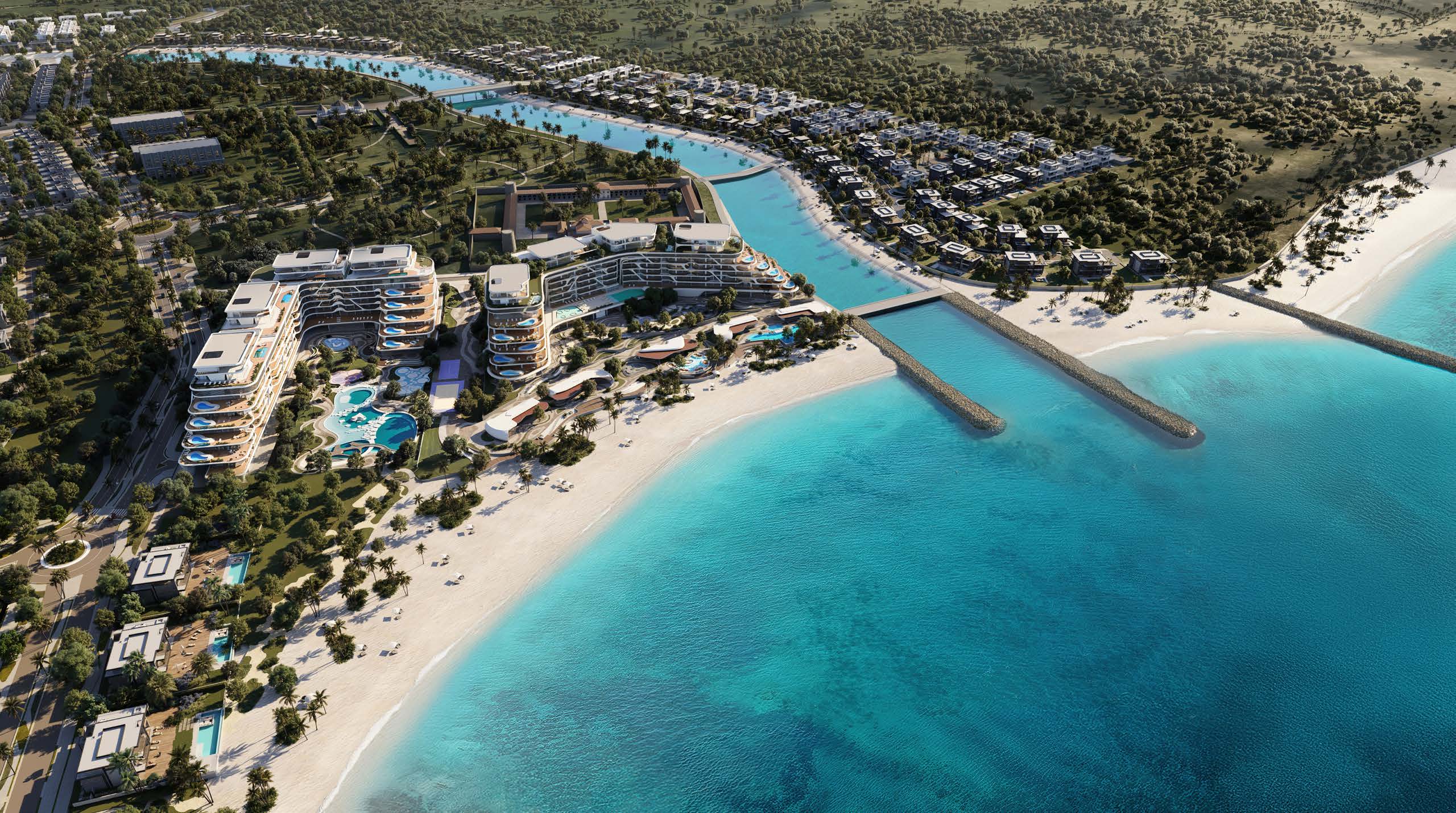 Aerial of the beachfront buildings, canal, villas and natural reserve at Al Jurf