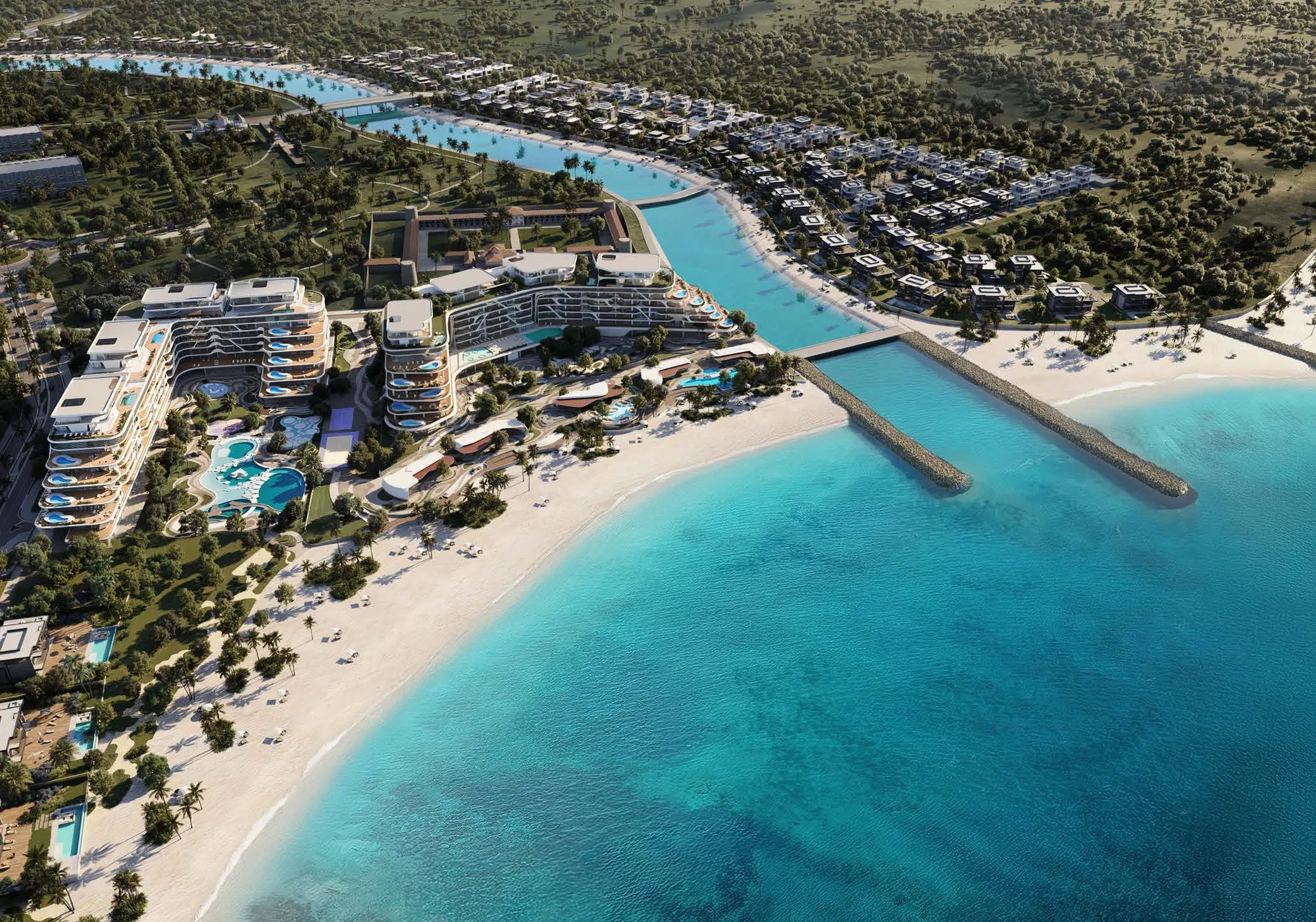 Aerial of the beachfront buildings, canal, villas and natural reserve at Al Jurf