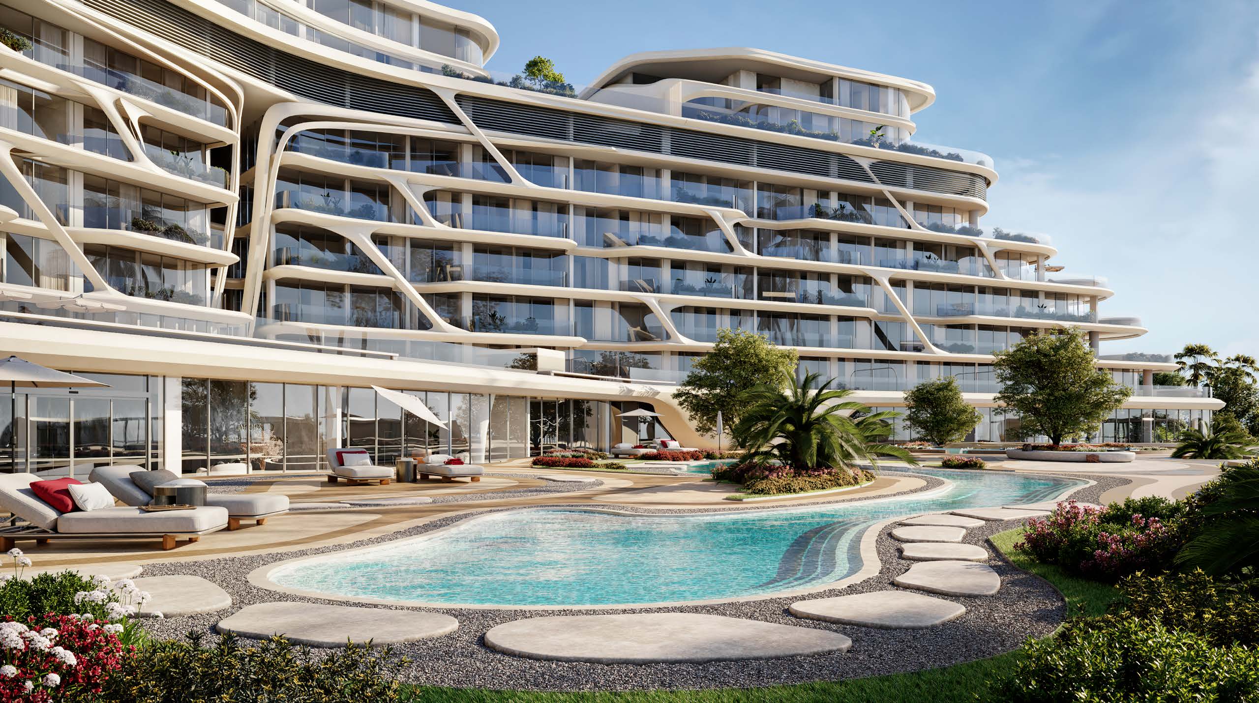 Flowing white façade with balconies above a garden pool and sun loungers