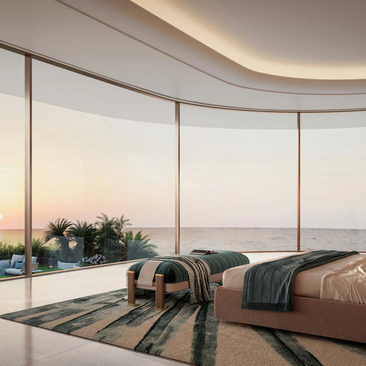 Master bedroom with curved floor-to-ceiling glass facing the sea at sunset