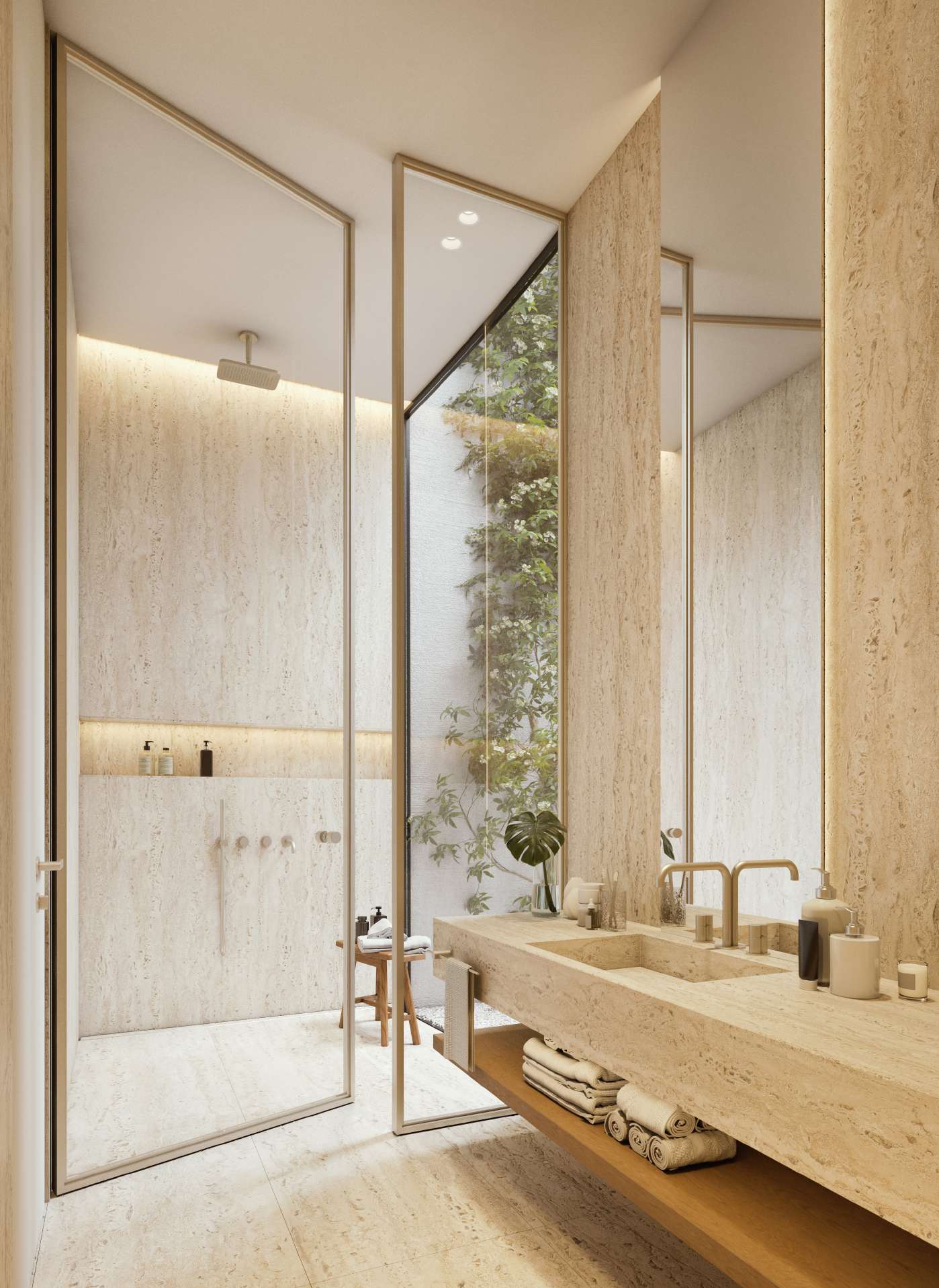 Travertine bathroom with glass shower and a glimpse of greenery