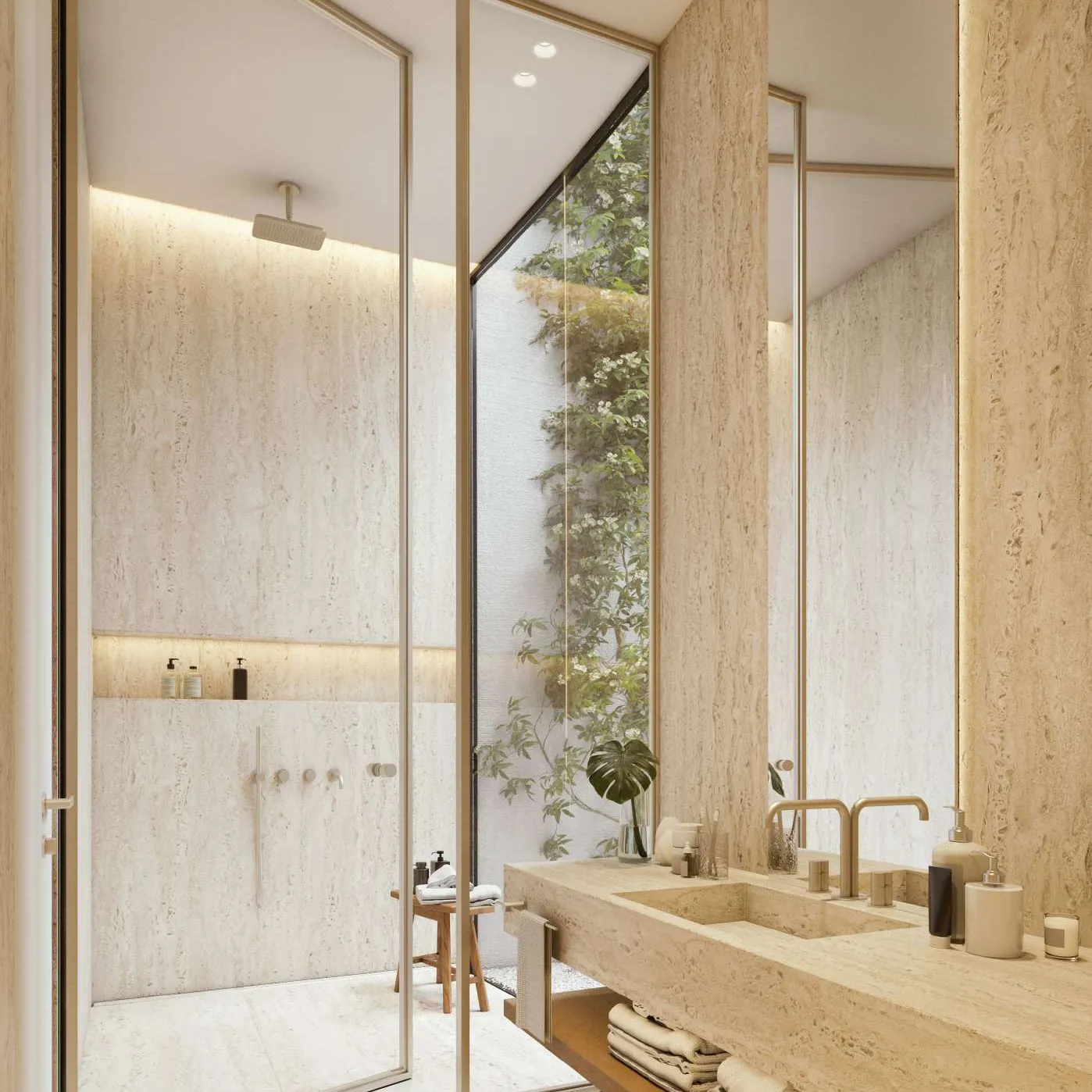 Travertine bathroom with glass shower and a glimpse of greenery