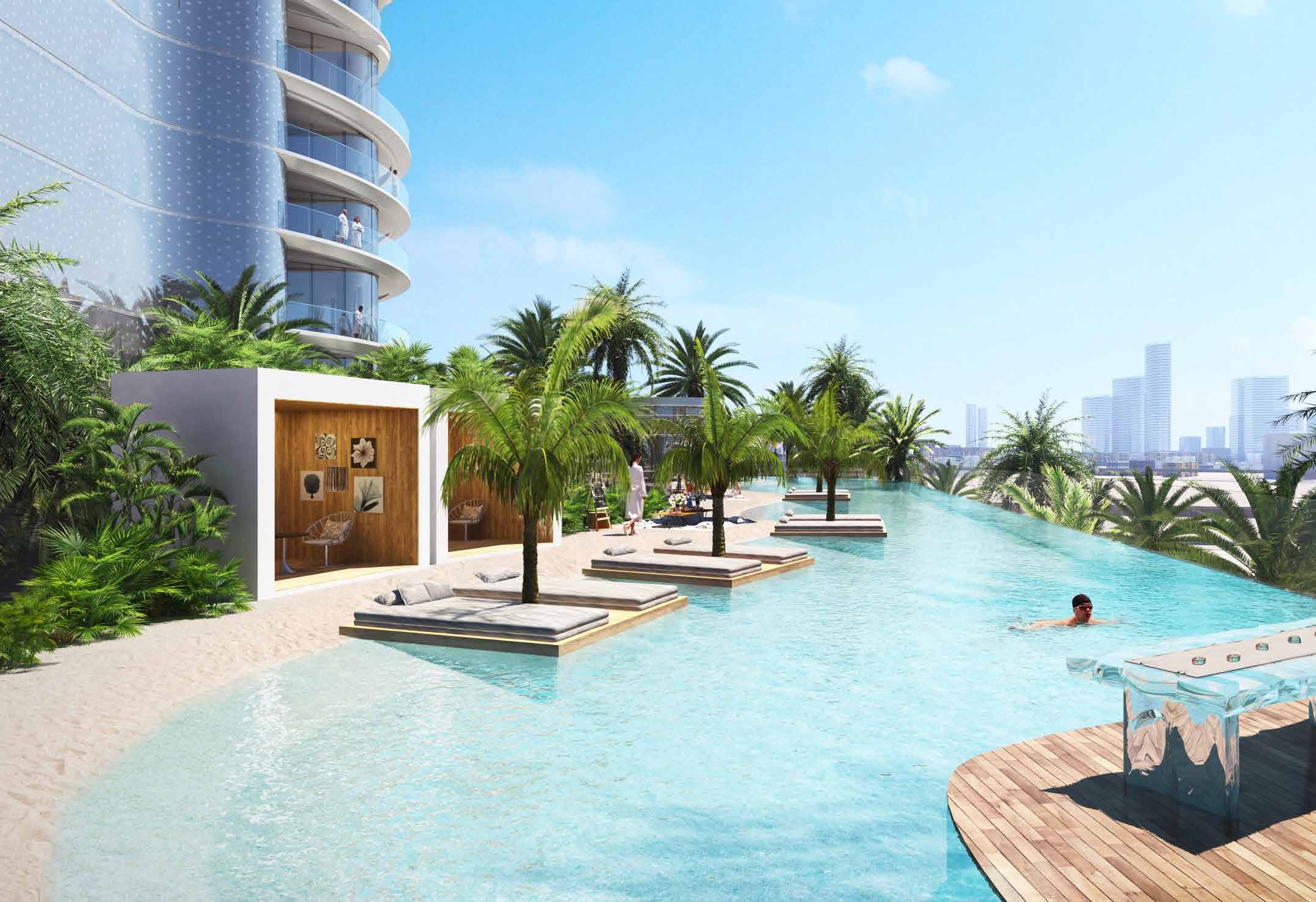 Sand beach, cabanas and long pool with sun loungers on the podium