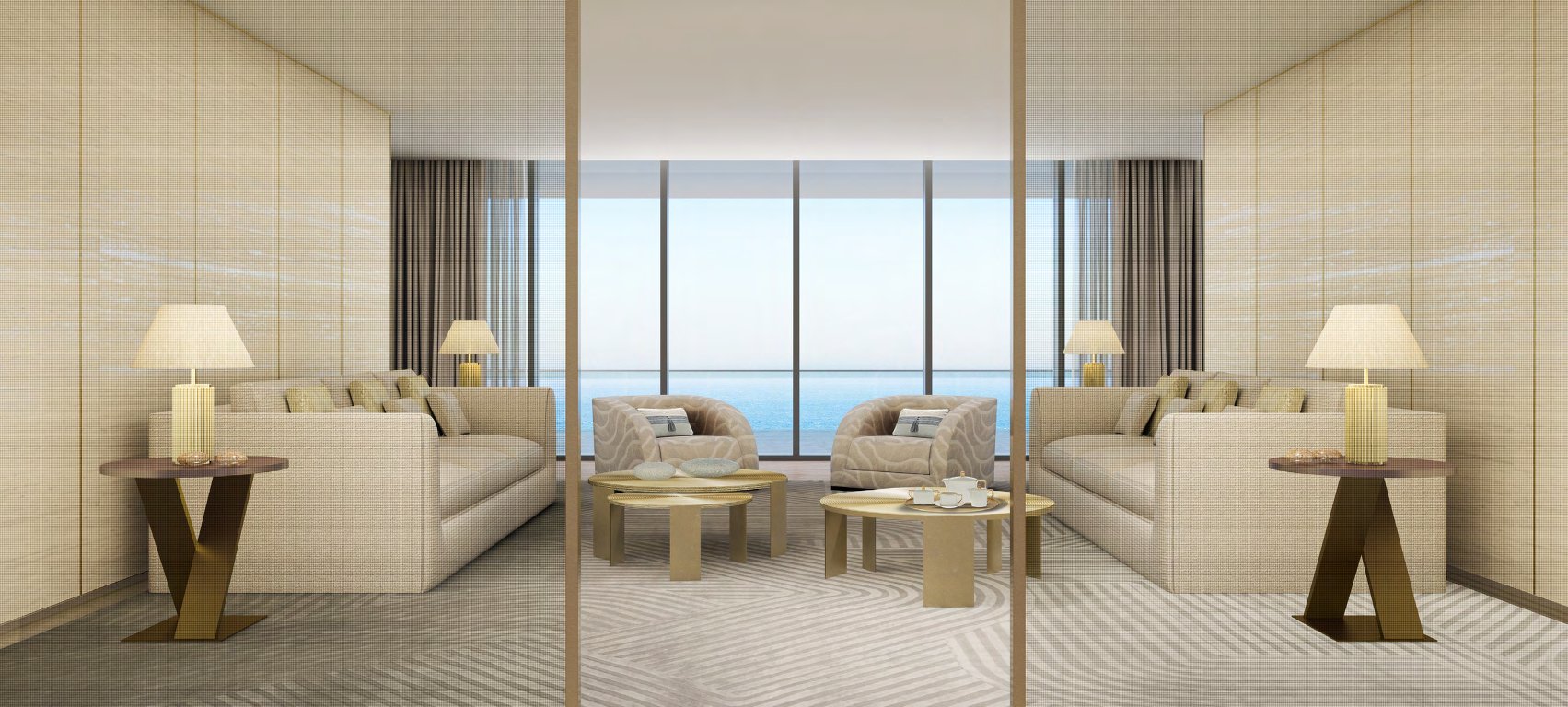 Sand-toned sitting room with sofas, brass tables and a wide sea view
