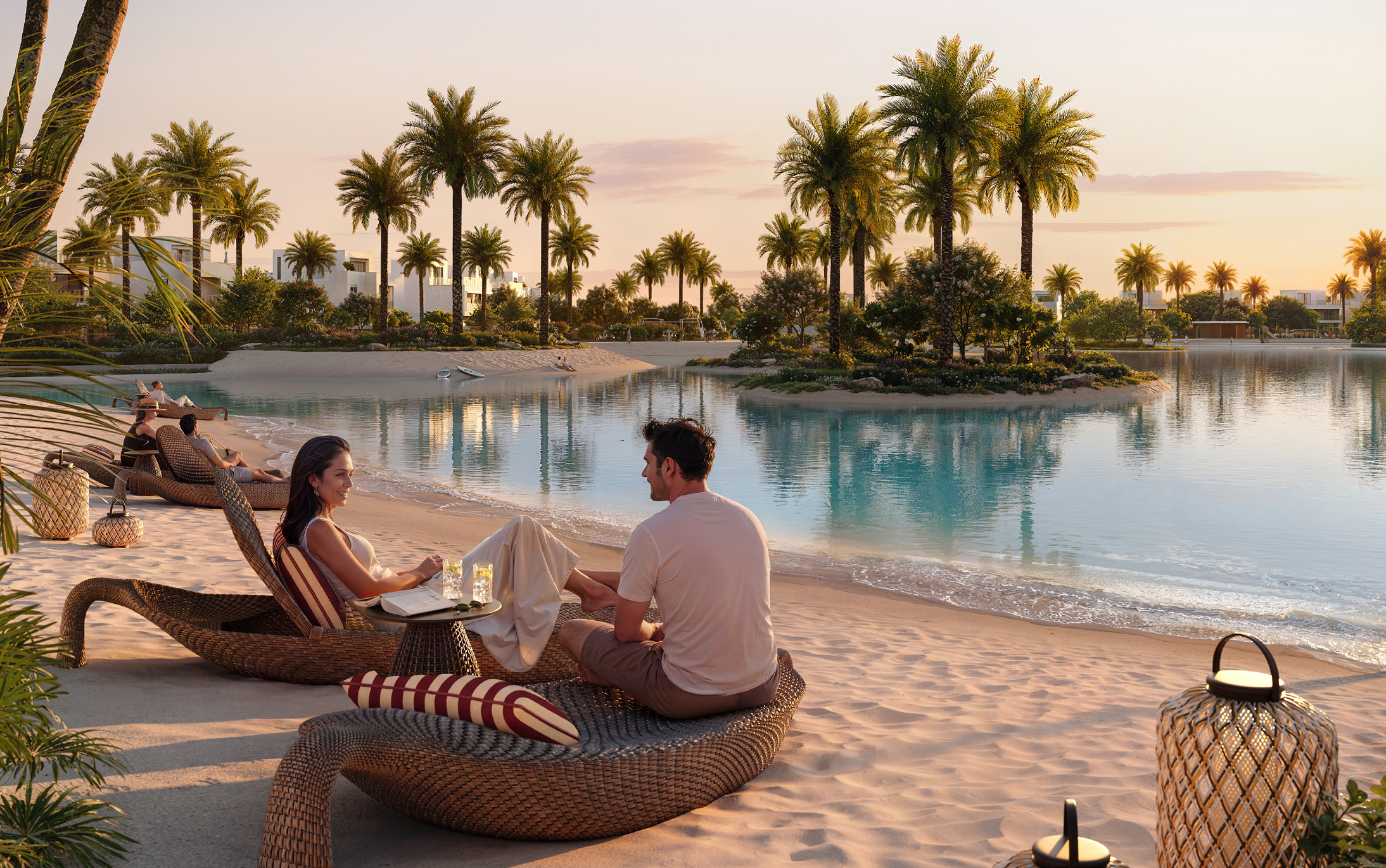 Sandy lakeside beach with palms and white villas at golden hour