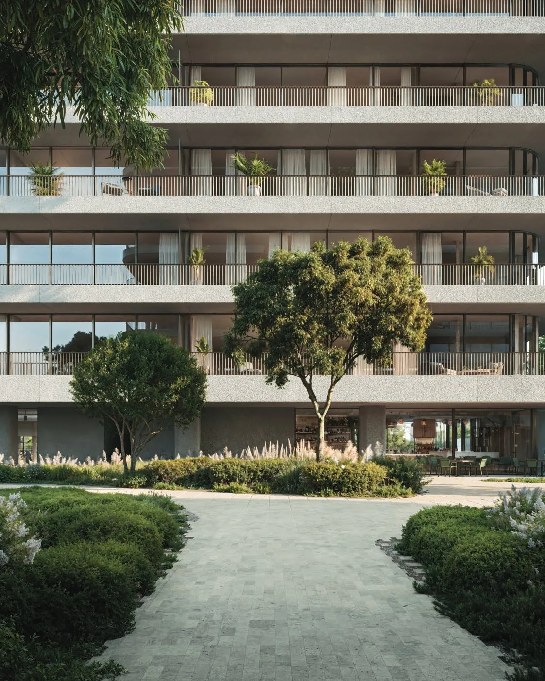 Curved balconies and glass facade above landscaped garden paths