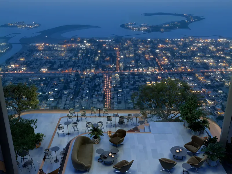 Clubhouse terrace at dusk overlooking city lights and the islands offshore