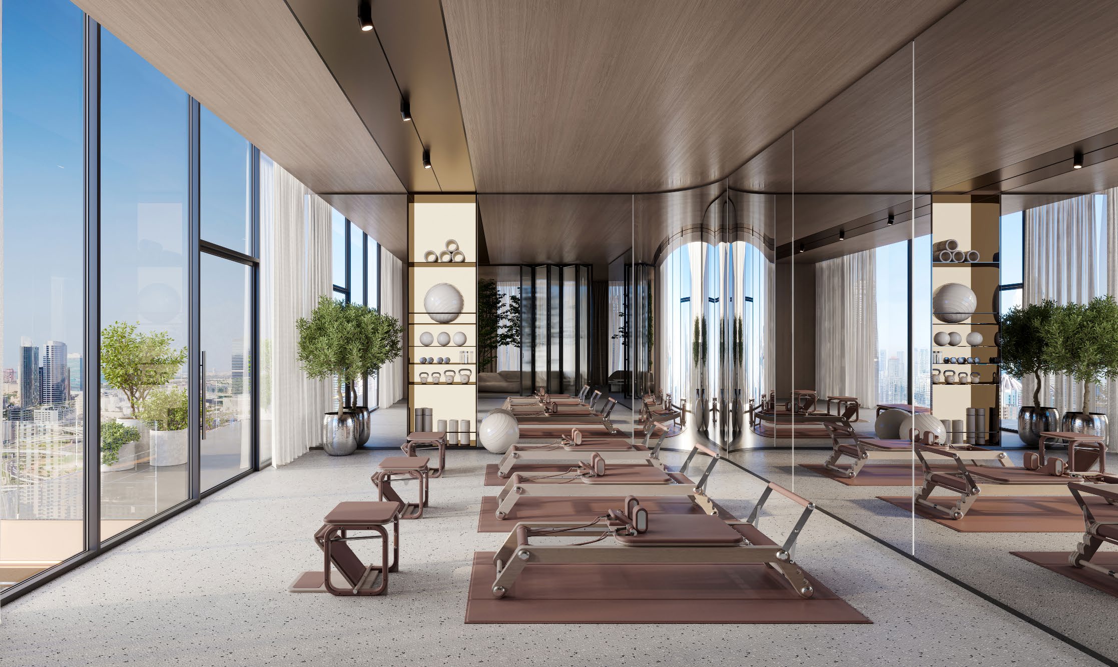 Pilates reformers in a wood-panelled studio with mirrored wall and city views