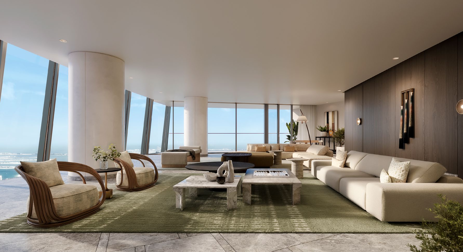 Wide living room with curved glass walls overlooking the sea