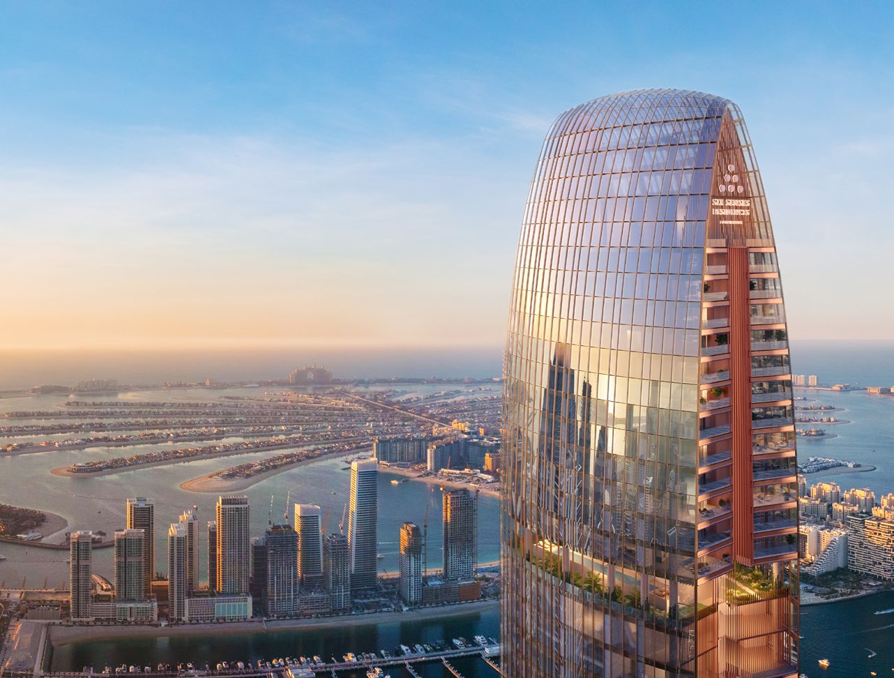 Crown of the tower at sunset above Dubai Marina and Palm Jumeirah