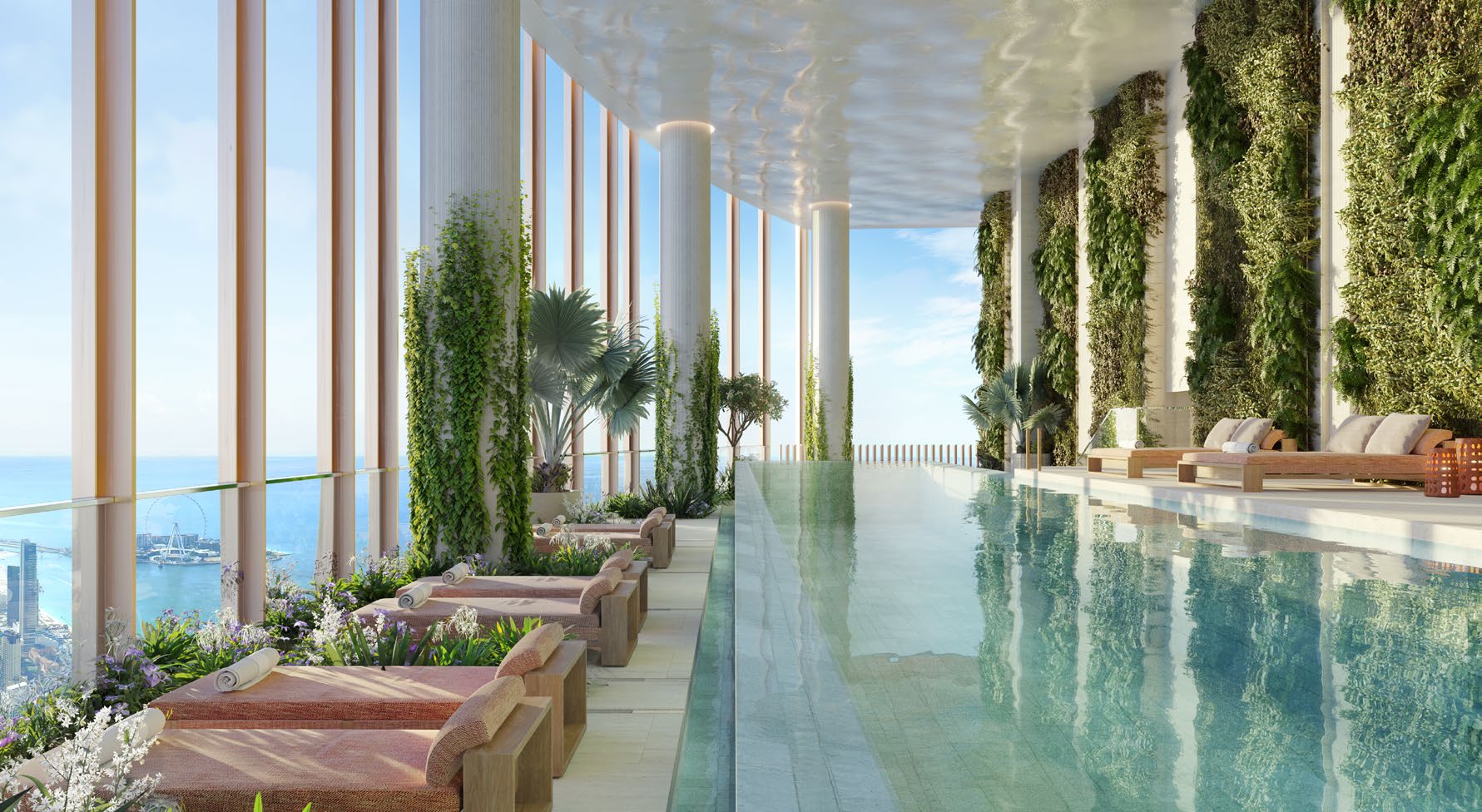 Lap pool on Level 109 with green walls, loungers and Ain Dubai view