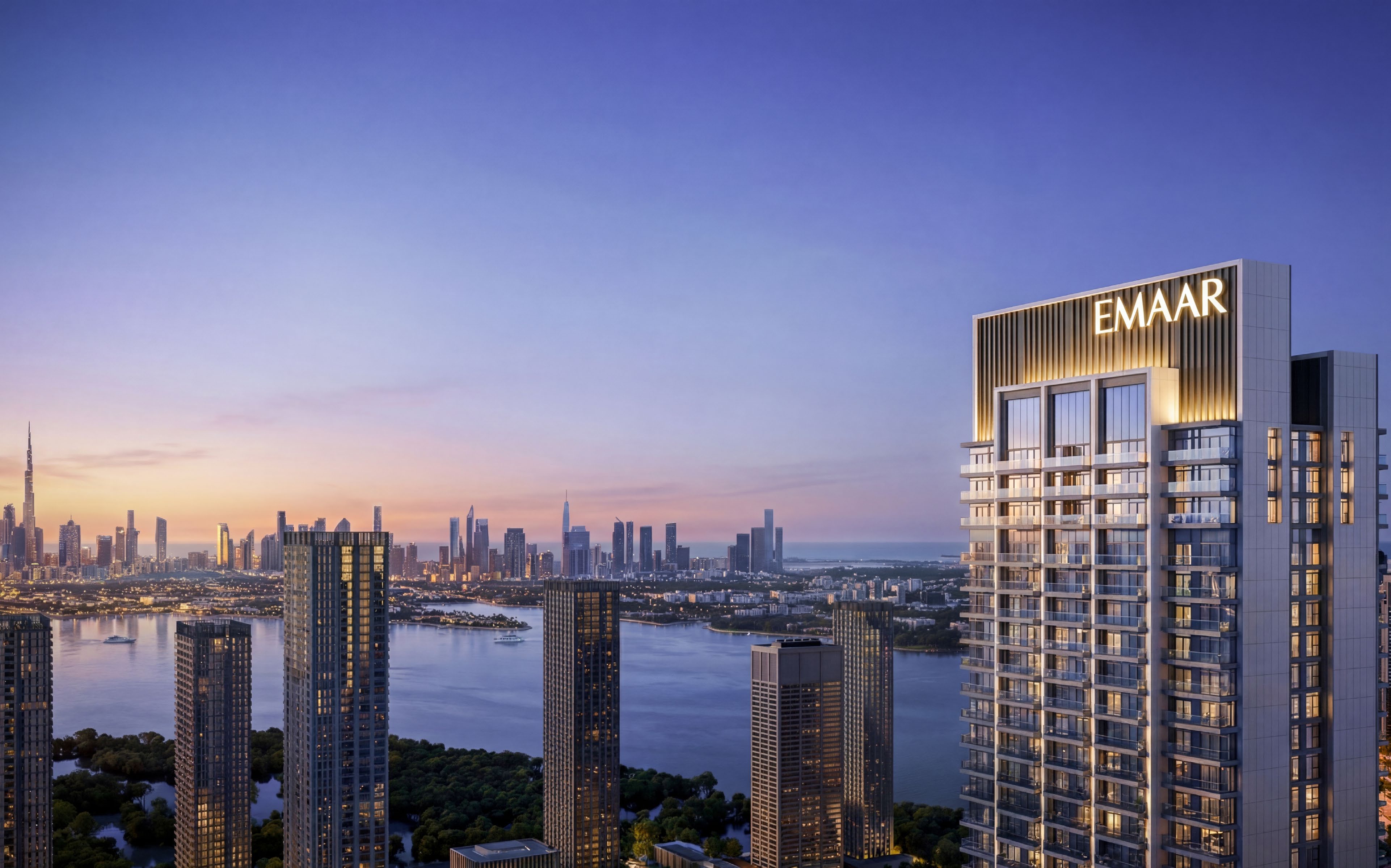 Aerial view of Dubai Creek Harbour towers, mangroves and water at dusk