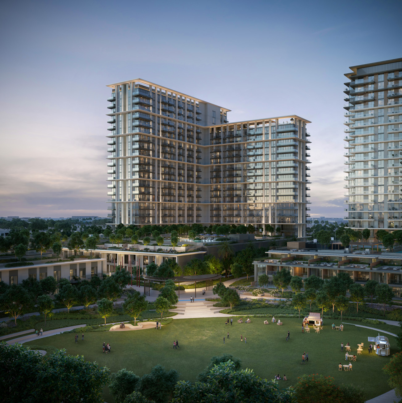 Palace Residences Hillside tower at dusk overlooking a wide green park