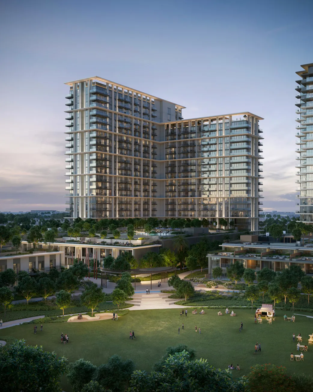 Palace Residences Hillside tower at dusk overlooking a wide green park