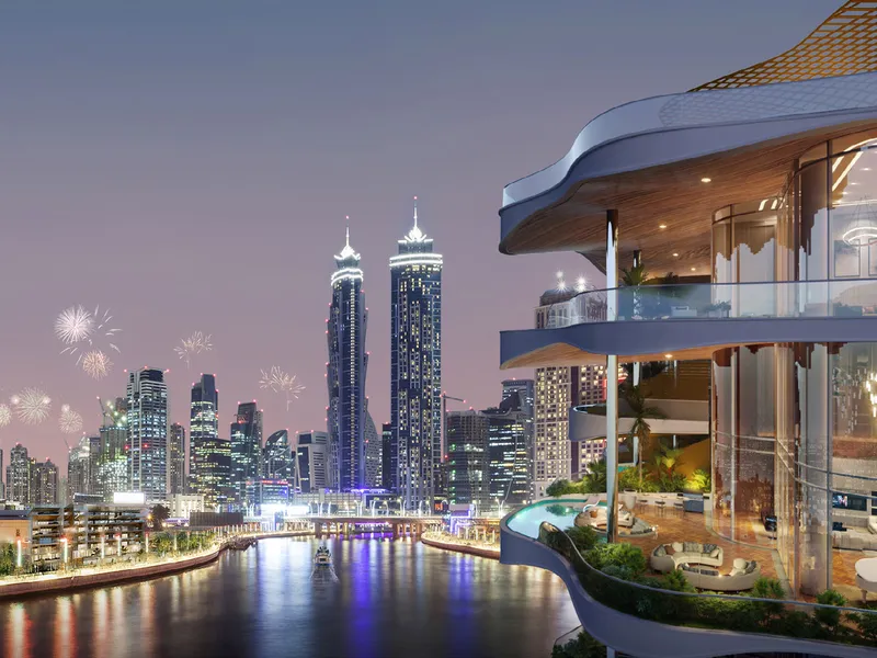 Curved terrace with pool overlooking the canal and city skyline at dusk