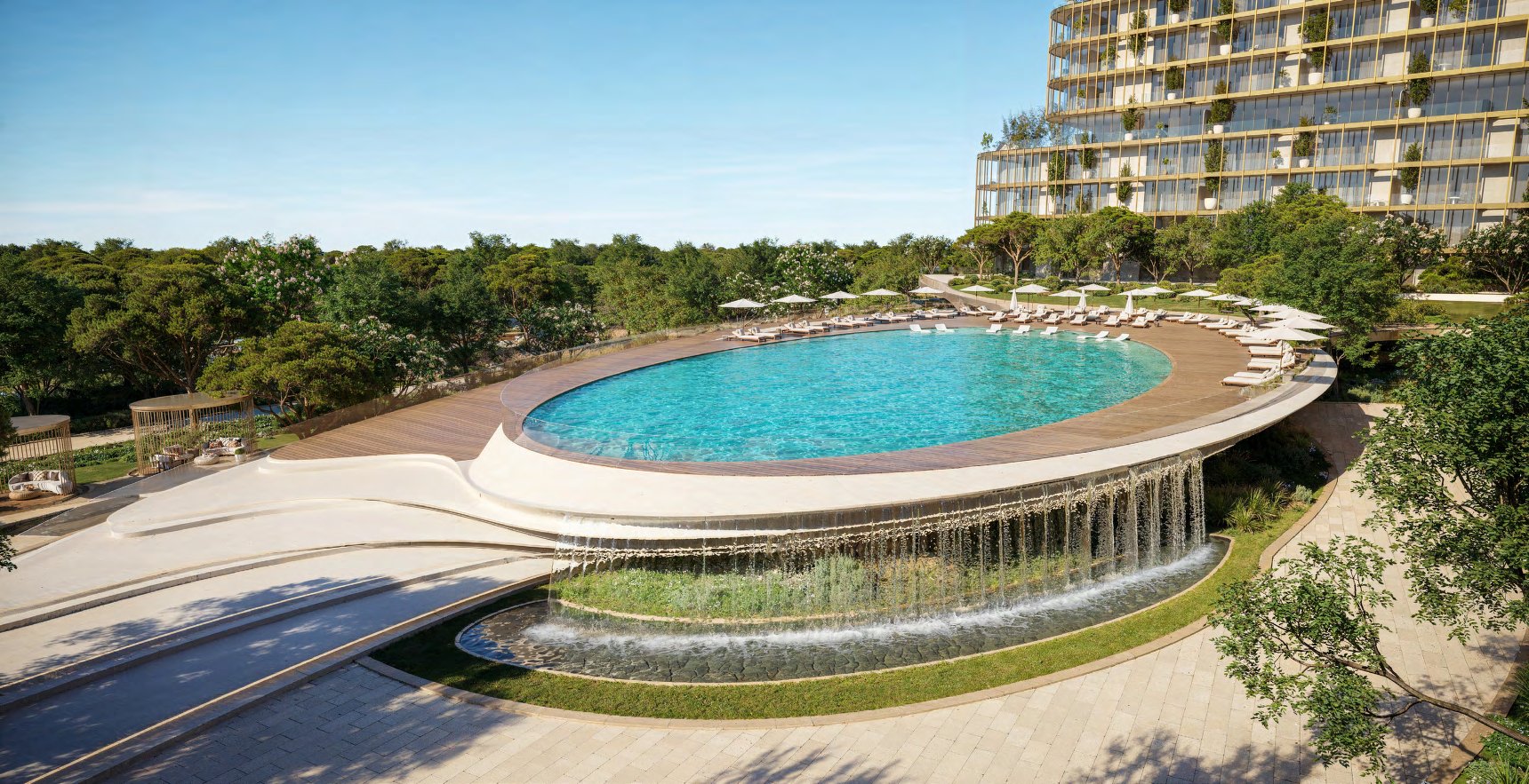 Oval pool deck with loungers and a water cascade below its edge