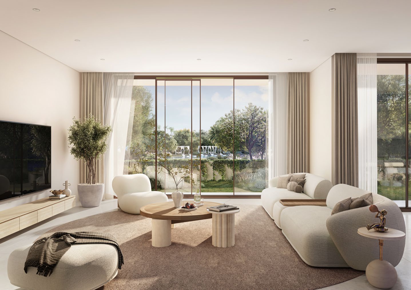 Bright living room with tall glass doors onto the garden