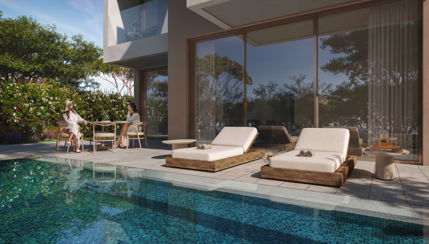 Terrace with sun loungers beside a tiled private pool