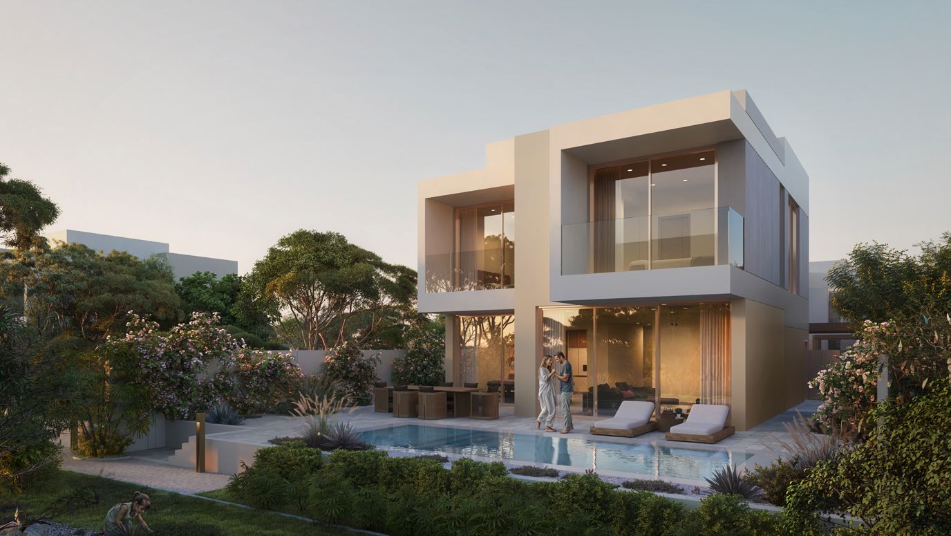 Two-storey villa at dusk with private pool and lush garden