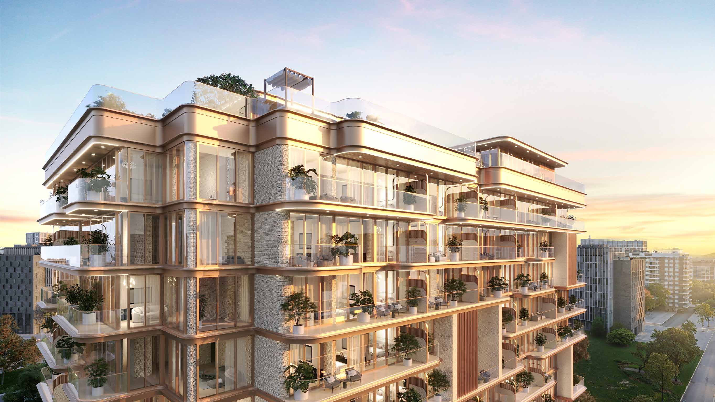 Curved building with glass terraces and potted trees, lit at sunset