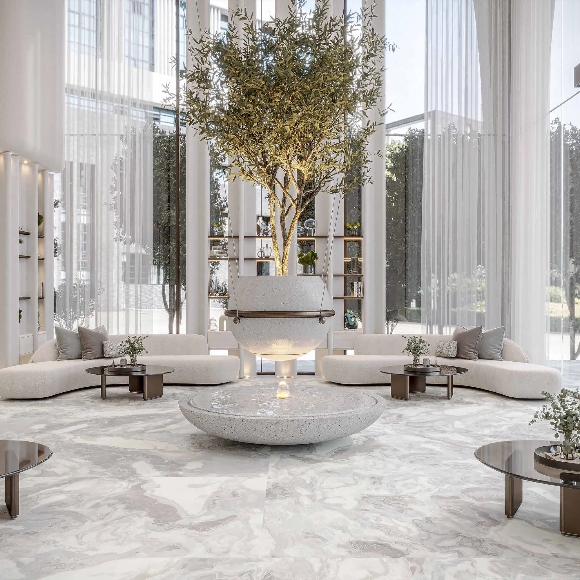 Bright lobby with curved white sofas, a central olive tree and sheer curtains