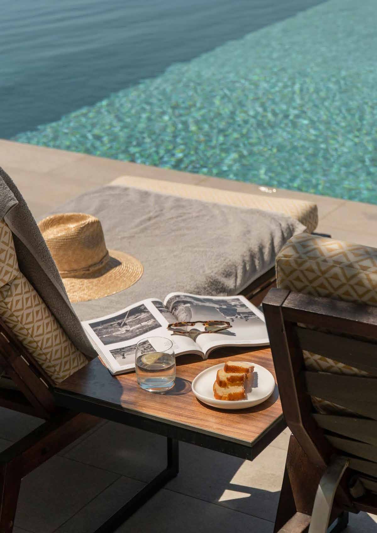 Poolside lounger beside the water