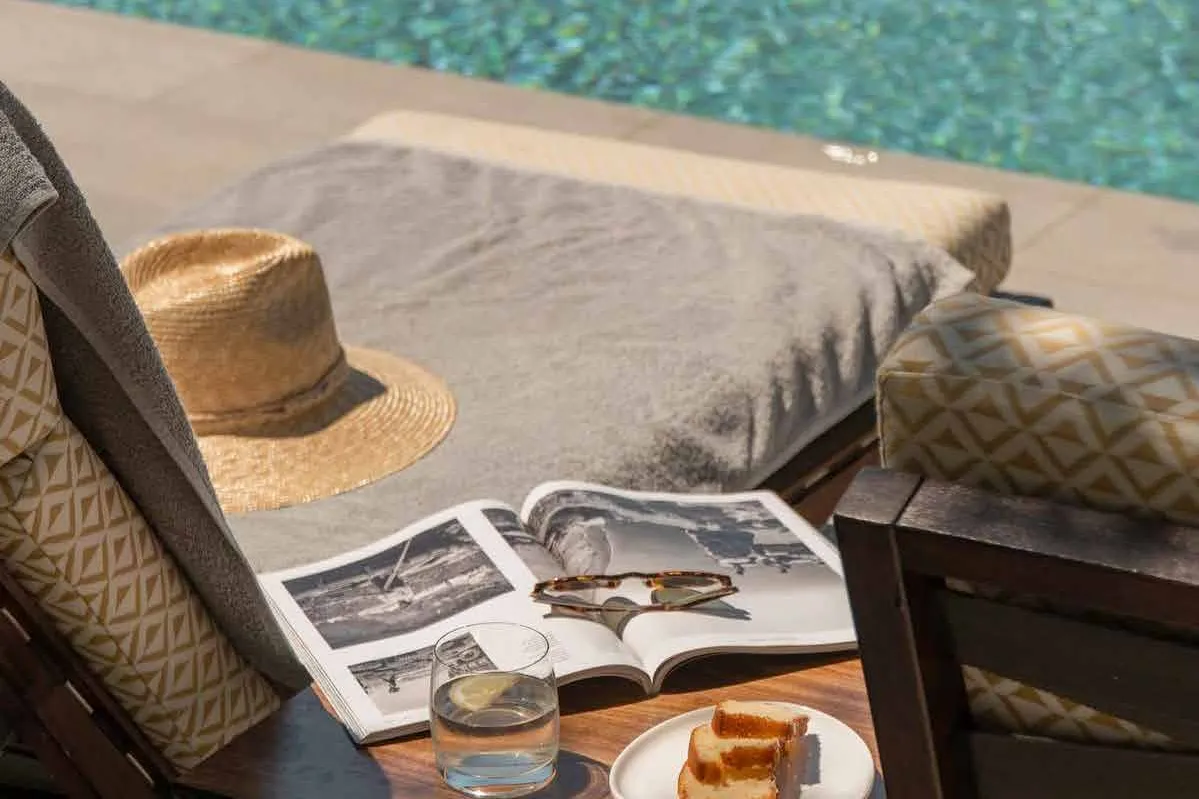 Poolside lounger beside the water