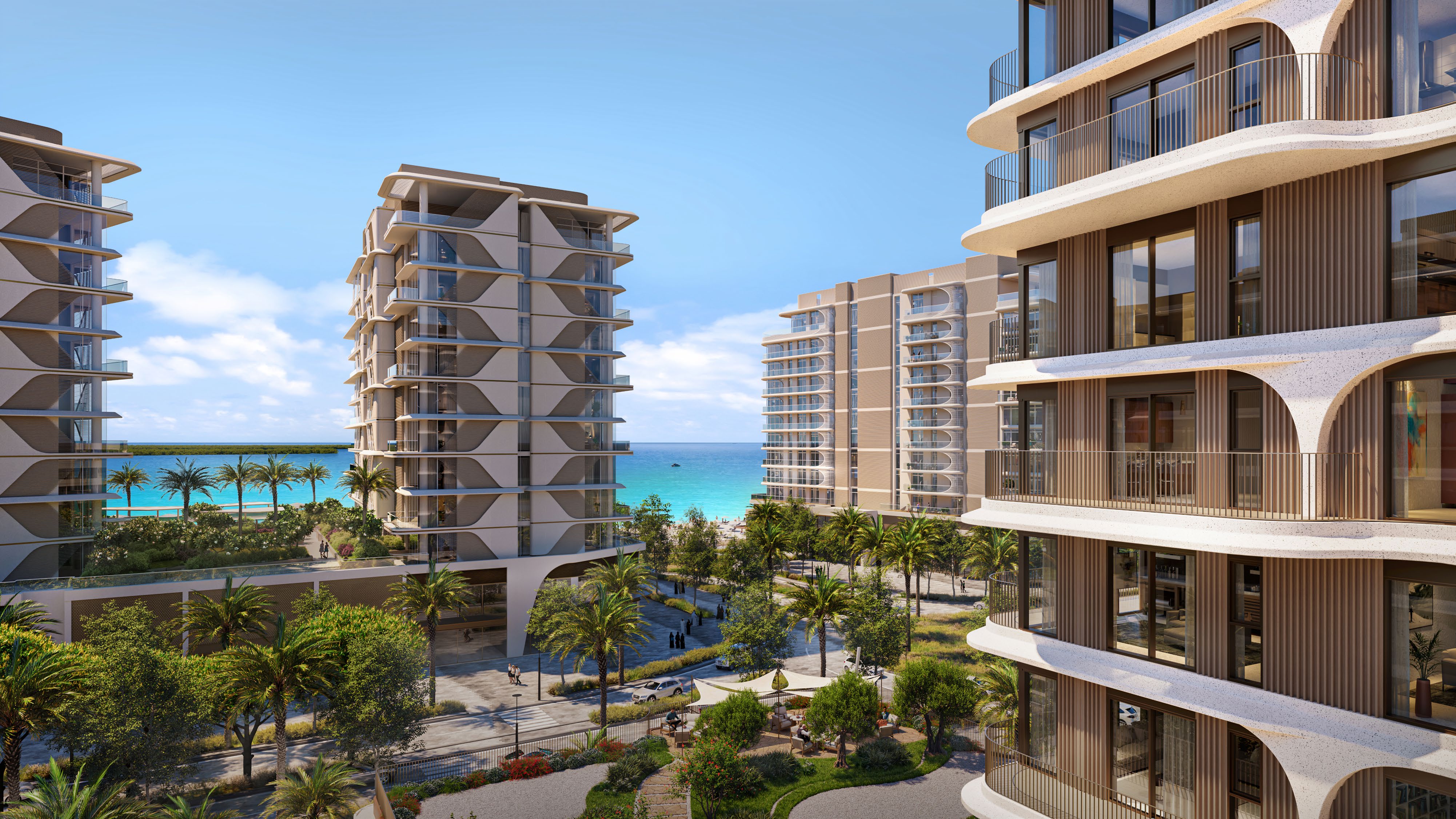 Curved balconies of the towers framing gardens and the sea beyond