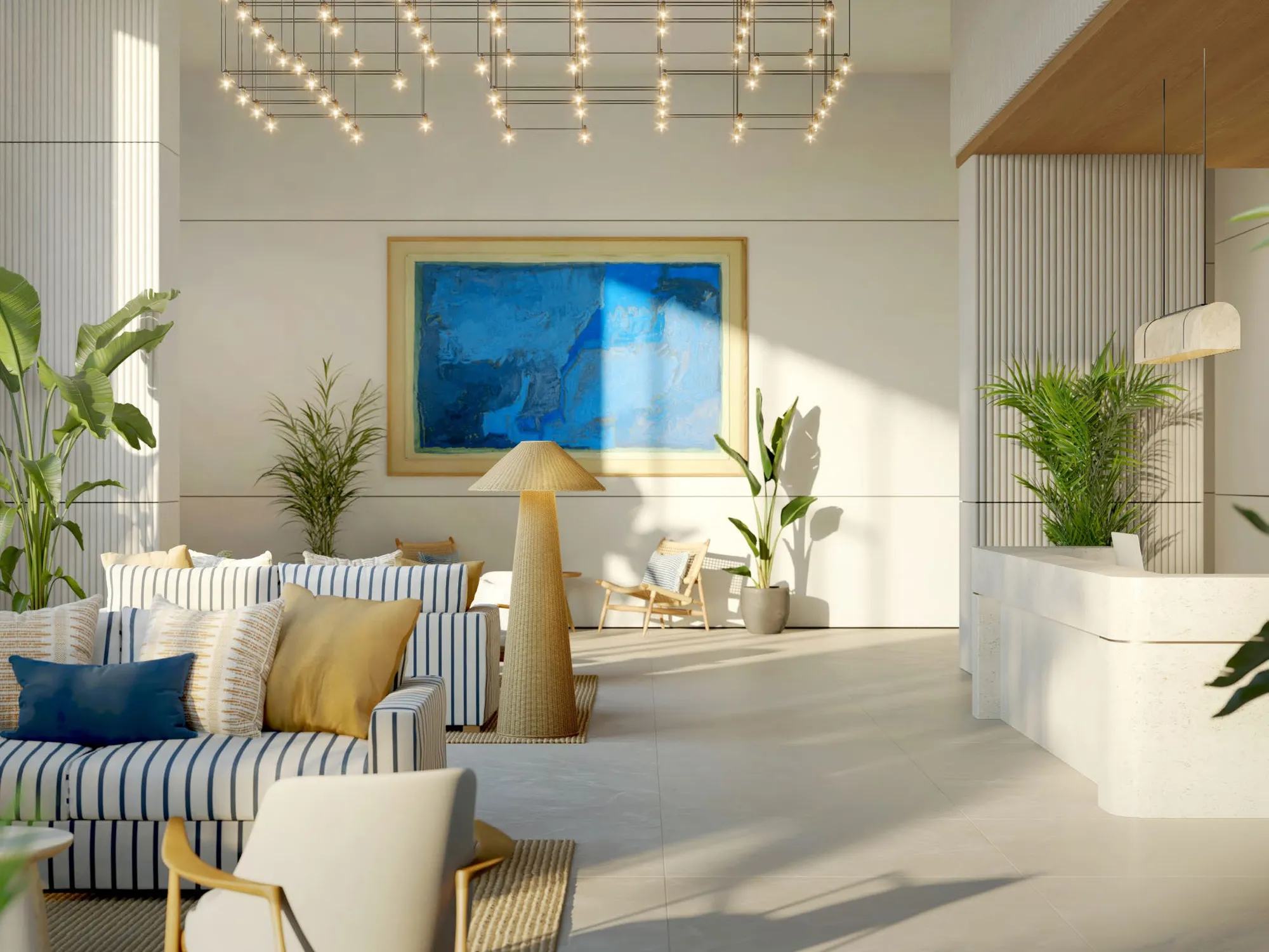 Bright lobby lounge with striped sofas, plants and a blue painting