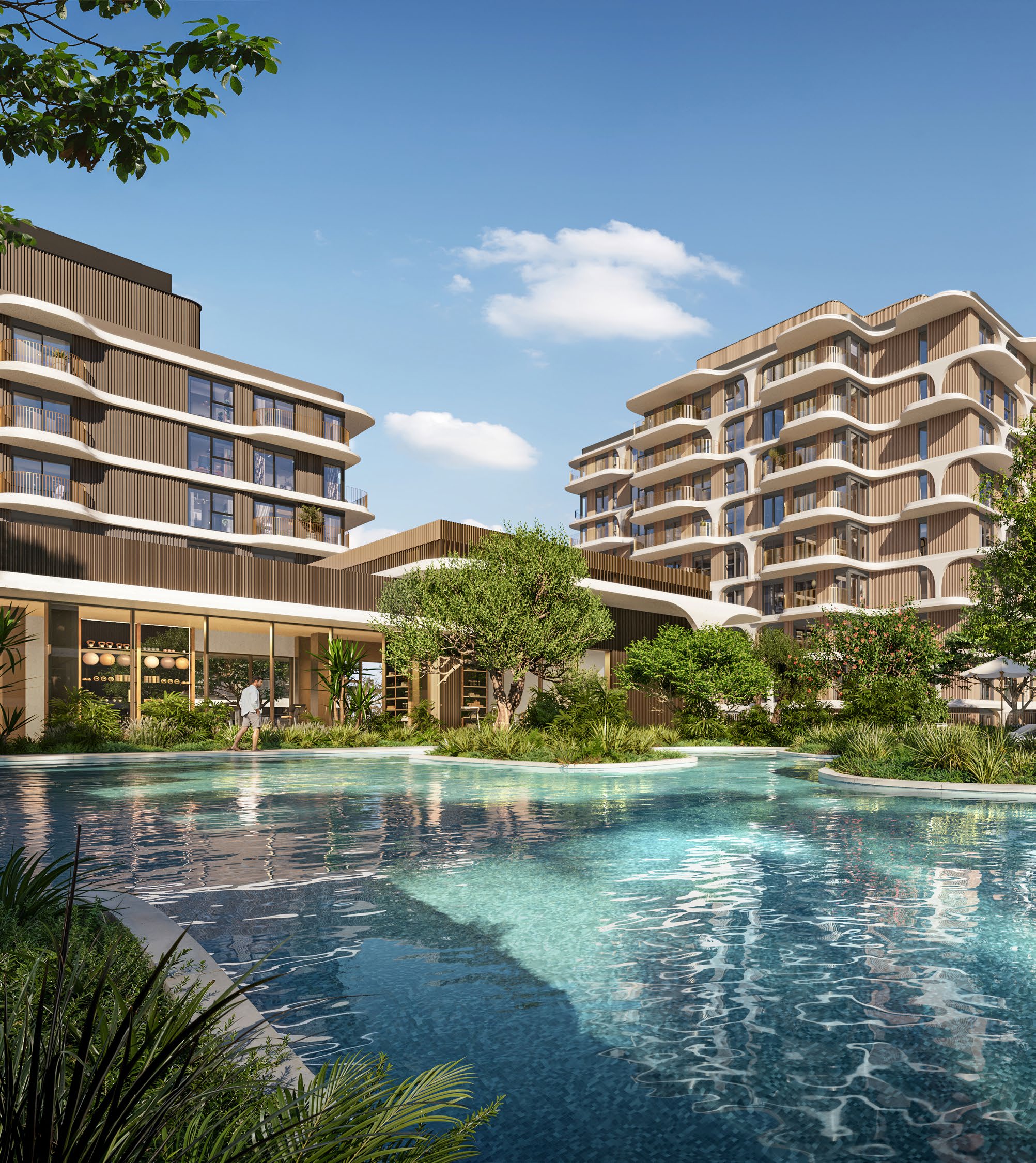 Lagoon-style podium pool surrounded by planting and the residential towers