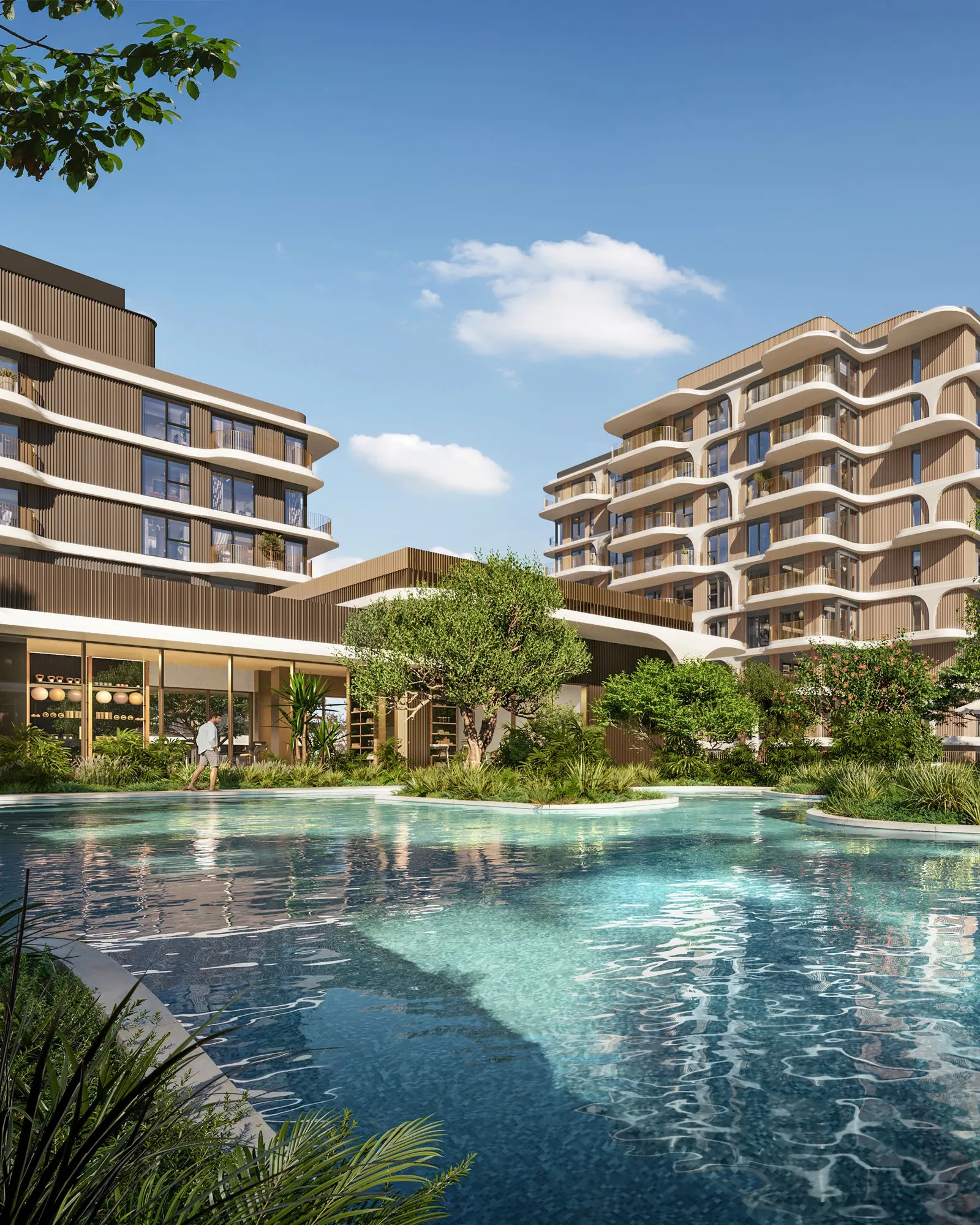 Lagoon-style podium pool surrounded by planting and the residential towers