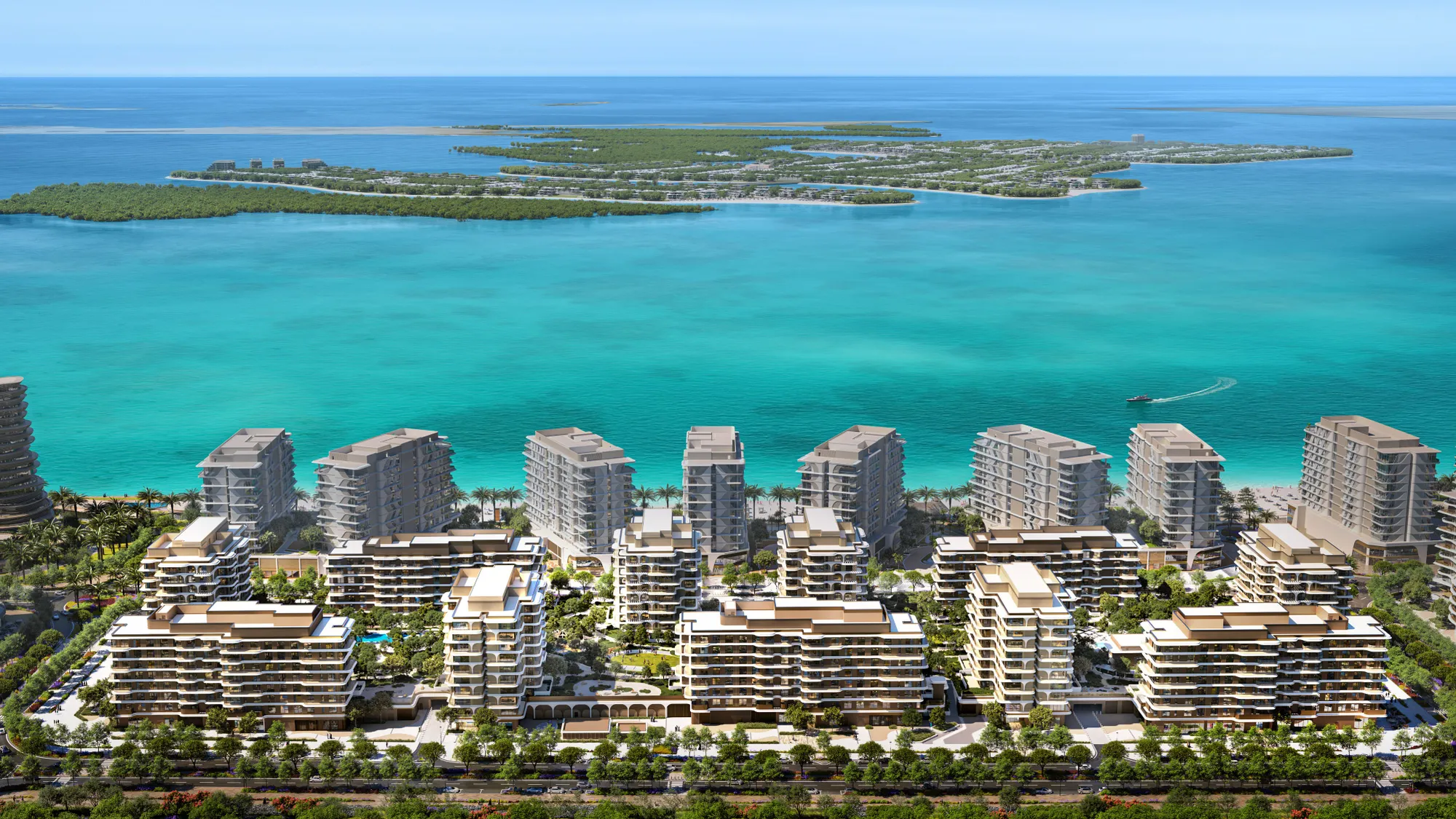 Aerial view of the Beach House towers and gardens beside a turquoise sea