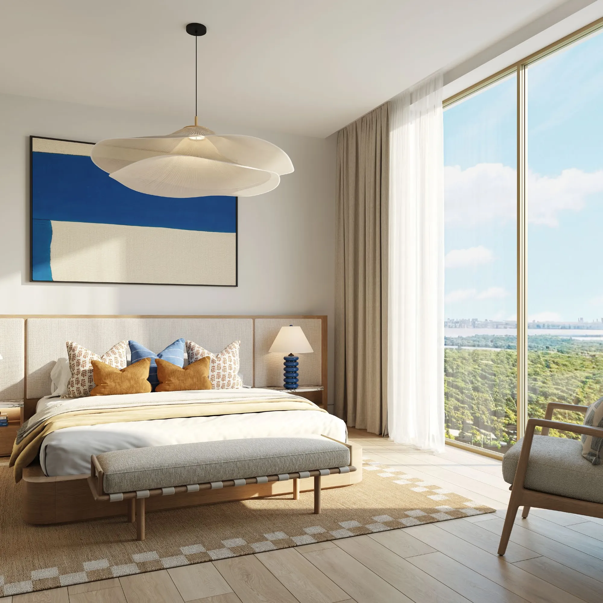 Main bedroom with tall windows looking over greenery towards the city