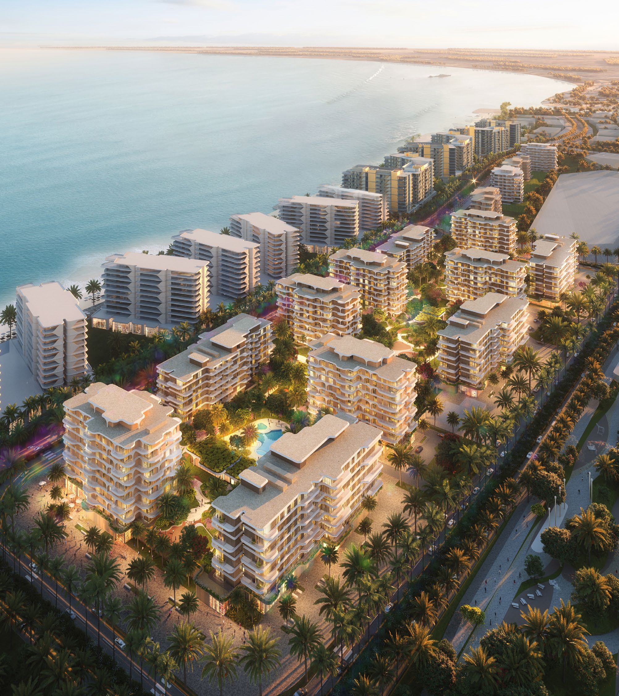 Evening aerial of the towers and palm-lined streets along the Fahid Island coast