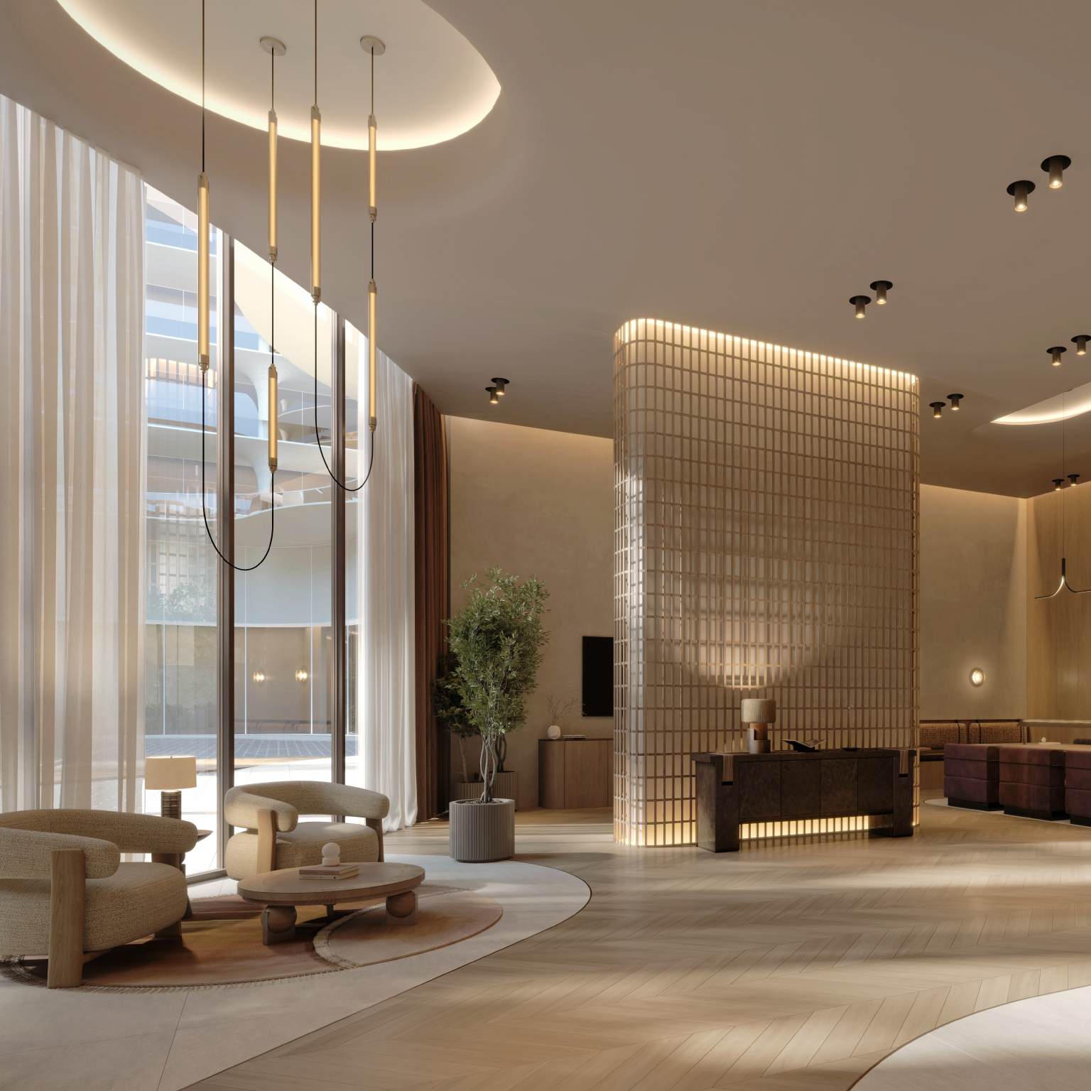 Bright lobby with tall windows, glass-block reception and soft armchairs