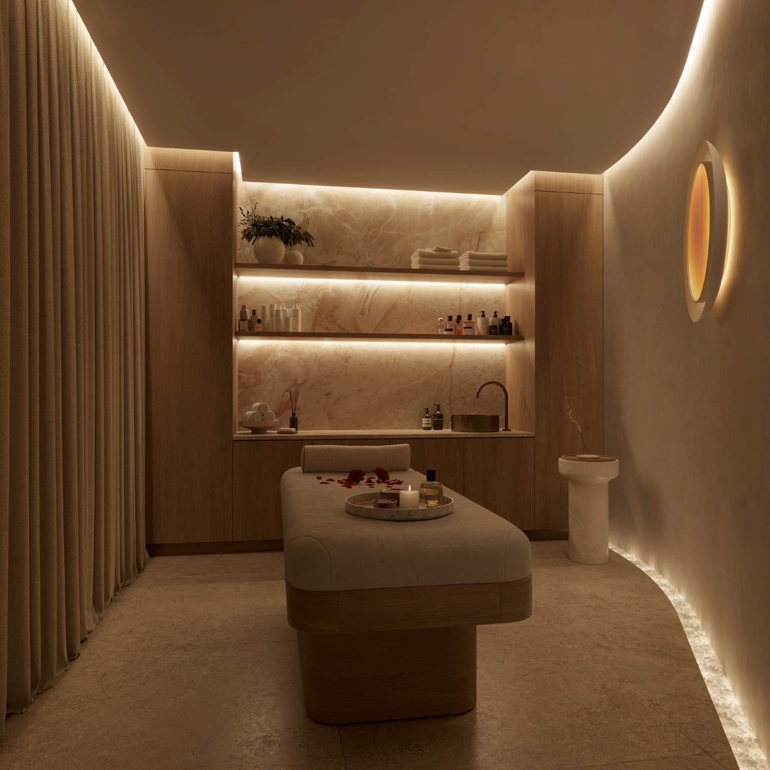 Softly lit treatment room in the Wellness Pod with onyx shelving