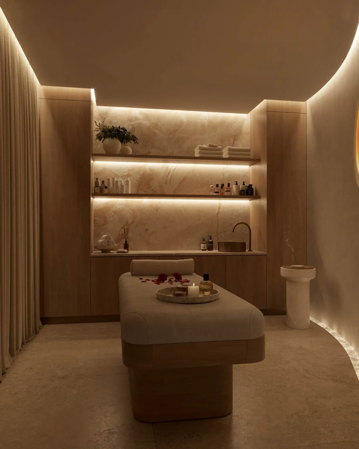 Softly lit treatment room in the Wellness Pod with onyx shelving