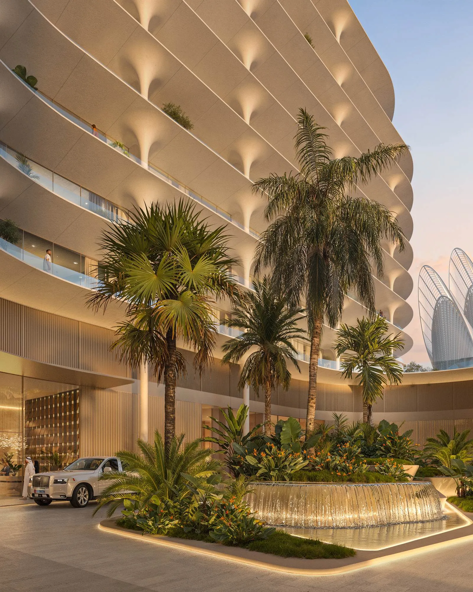 Arrival court with fountain and palms beneath The Row's curved balconies