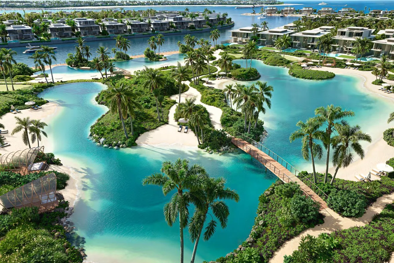 Turquoise lagoon with sandy islands, palms and a wooden footbridge