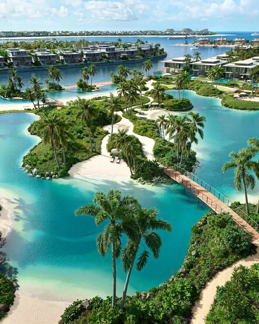 Turquoise lagoon with sandy islands, palms and a wooden footbridge