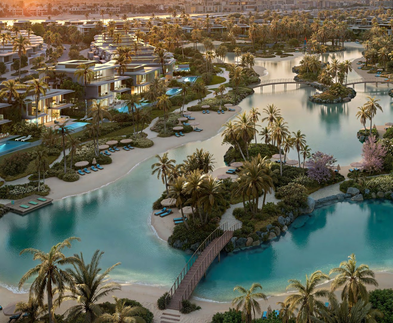 Lagoon at dusk with yoga deck, footbridges and lit villas behind