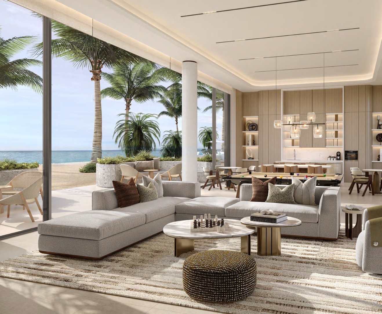 Lounge with sofas and a pool table opening onto the beach