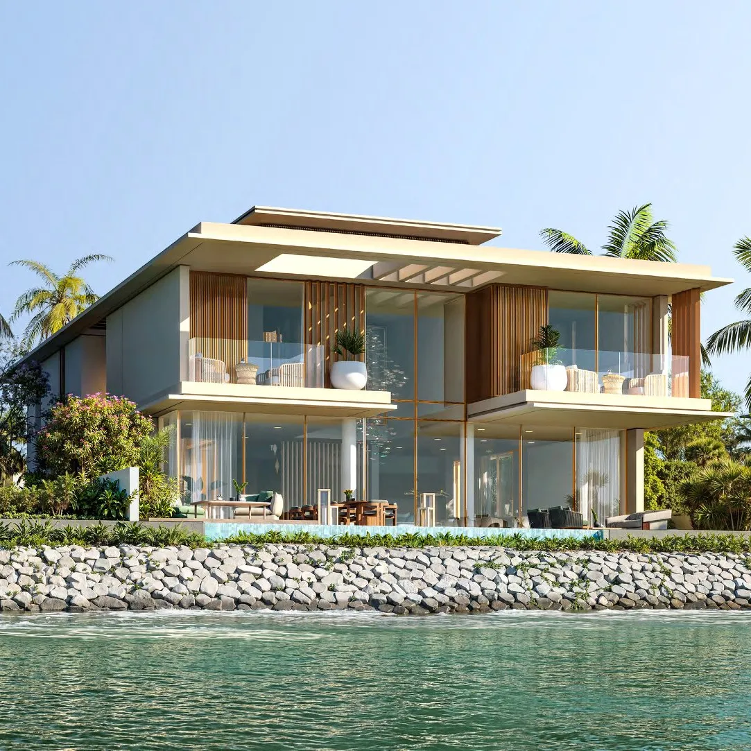 Reference design villa with balconies and pool above a rock-lined waterfront