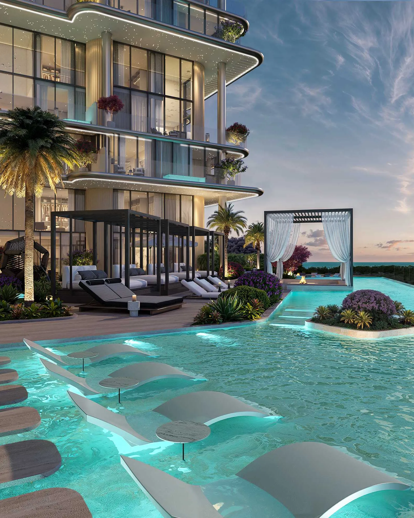 Pool with in-water loungers and cabanas glowing at sunset beside the tower