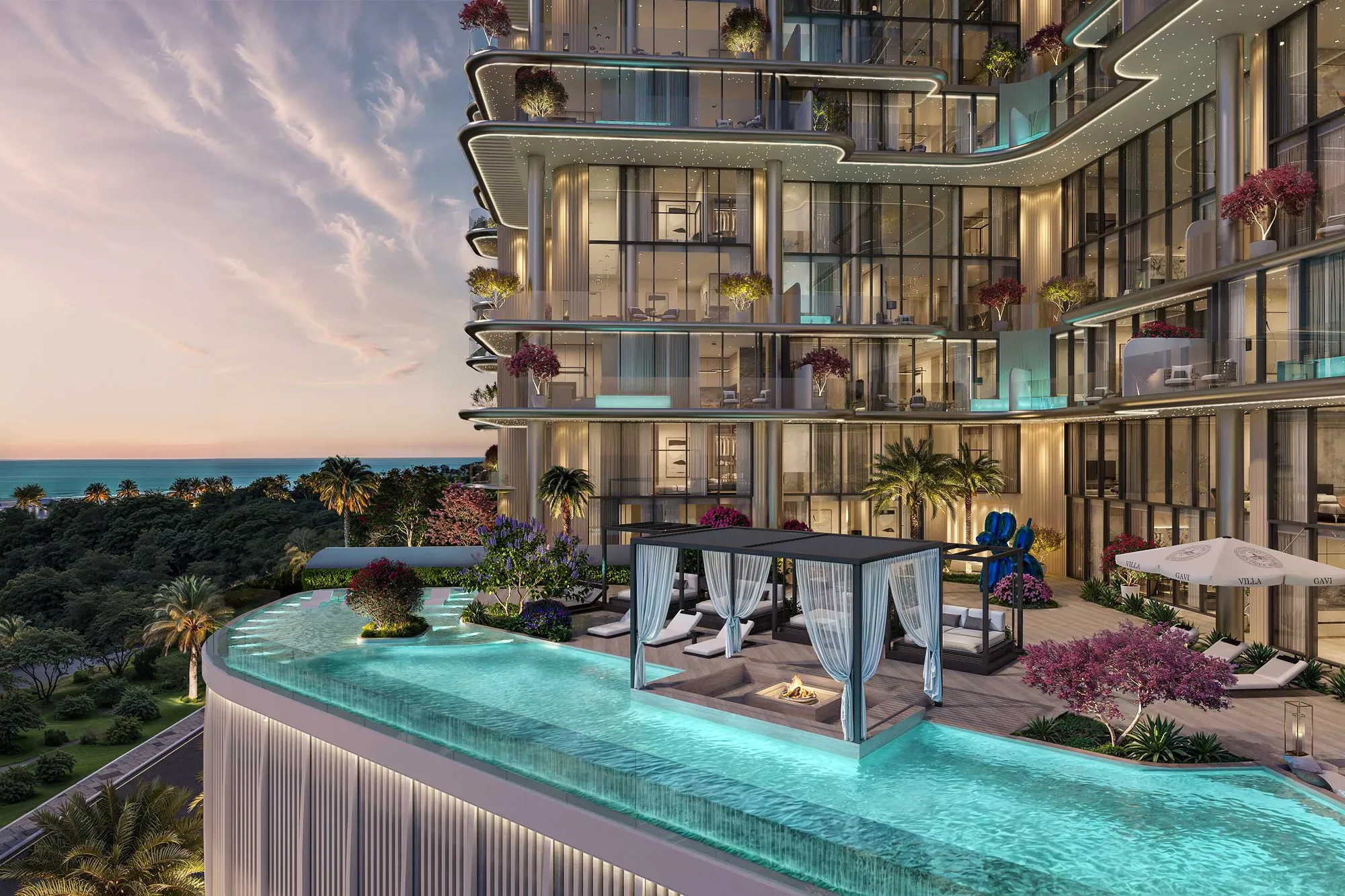 Infinity pool with cabana and fire pit beside the building at sunset
