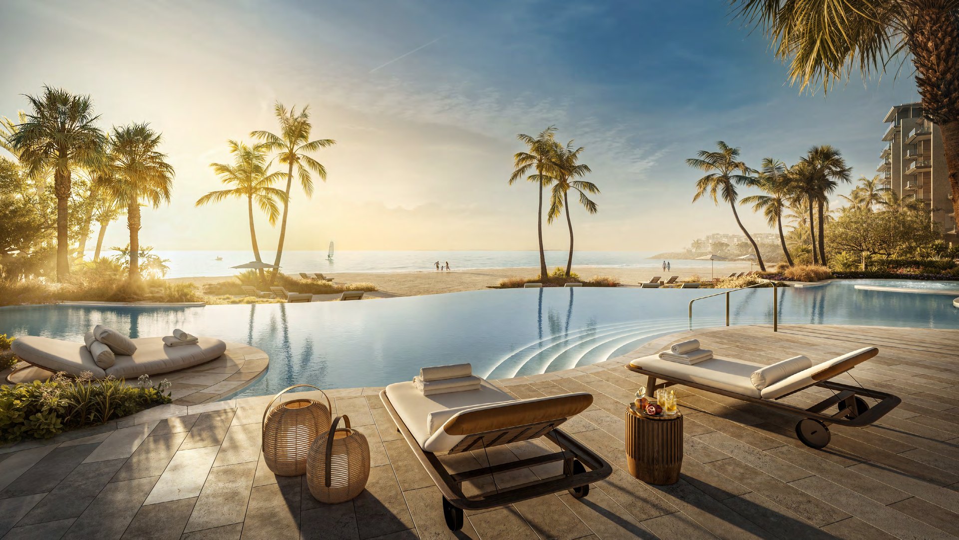Infinity pool with loungers looking over the beach towards the sea