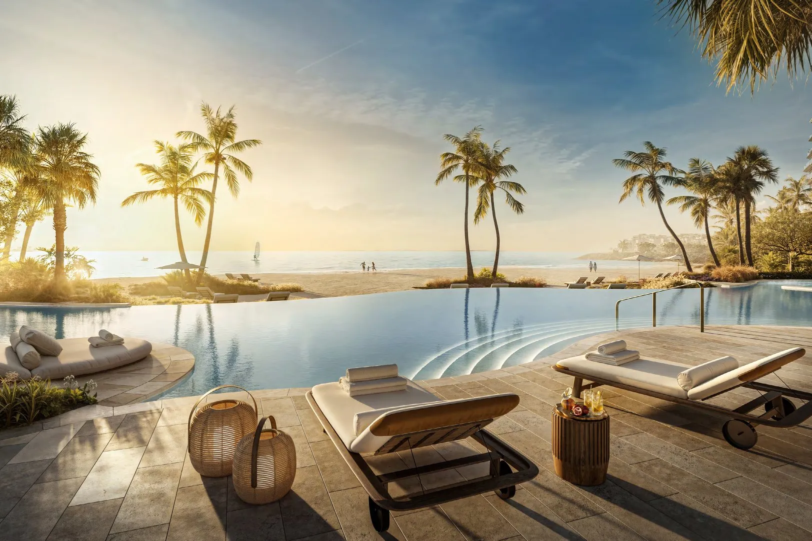 Infinity pool with loungers looking over the beach towards the sea